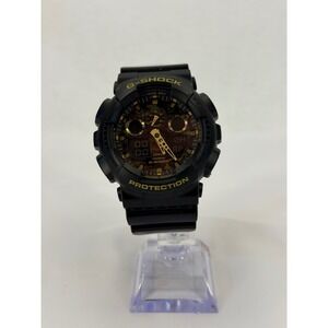 Casio G-Shock GA-100CF Black Gold Camo Dial Resin Mens Watch 5081